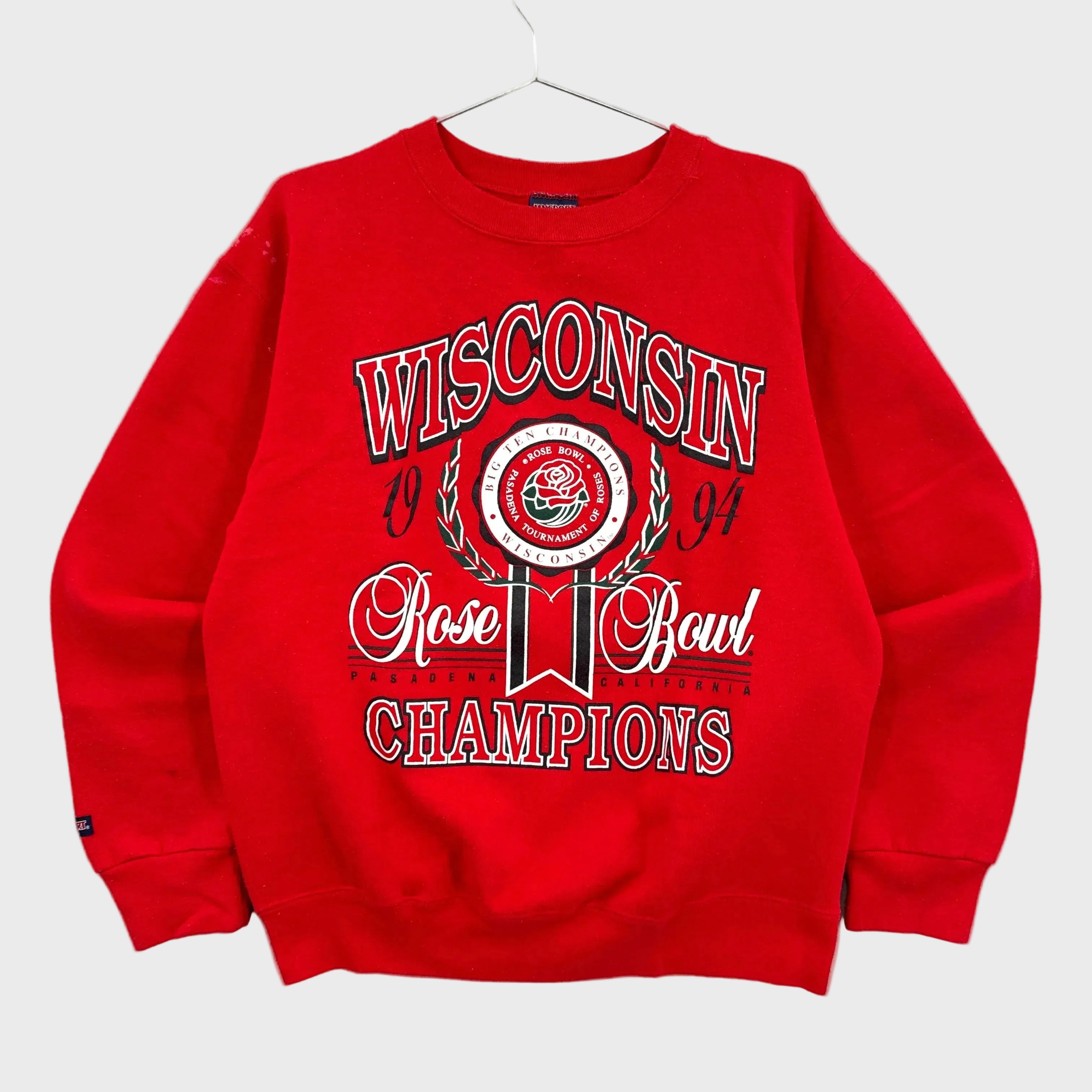 Red vintage 1994 crewneck sweatshirt with 'Wisconsin Rose Bowl Champions' text on a white background