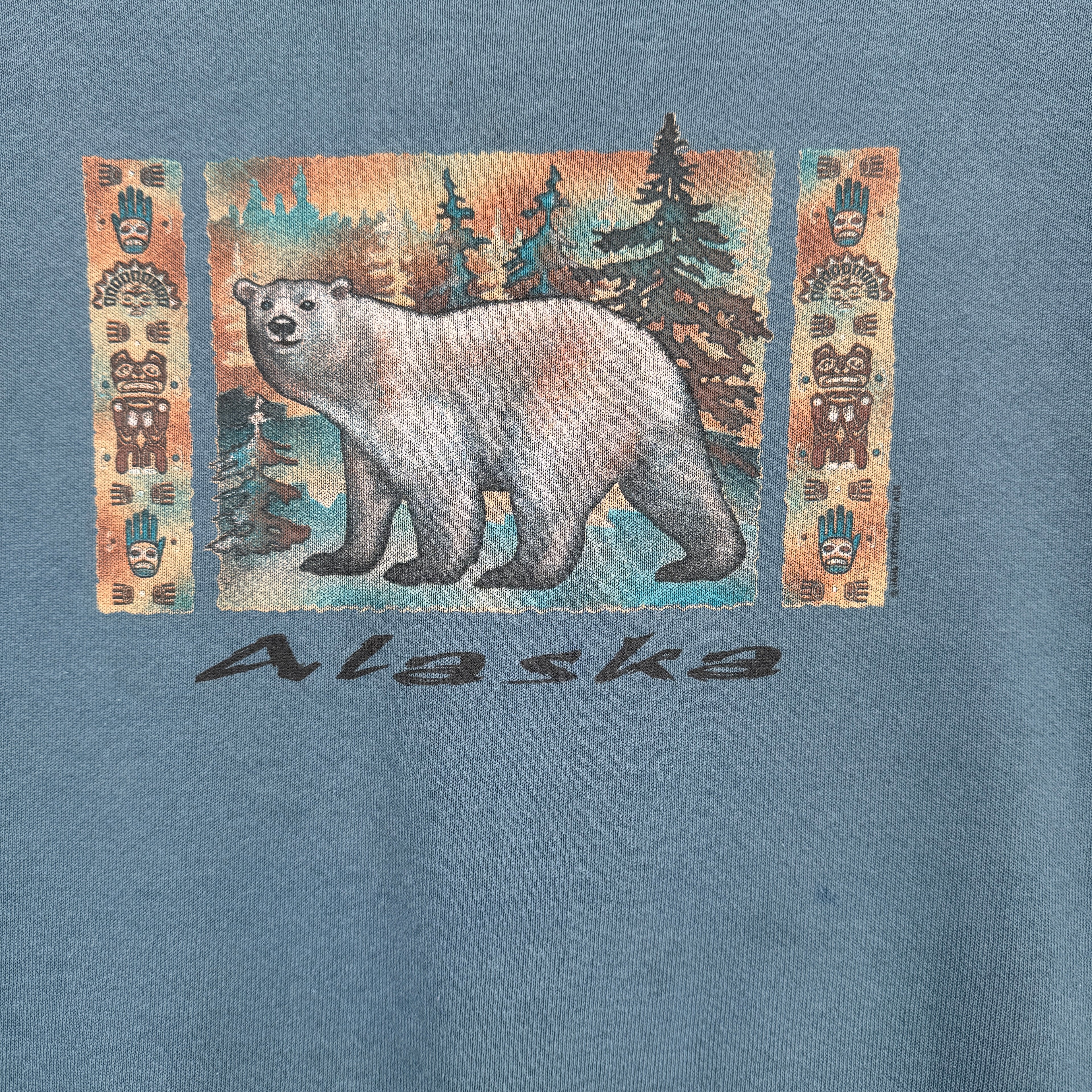 T-shirt with a bear graphic and 'Alaska' text on a blue background