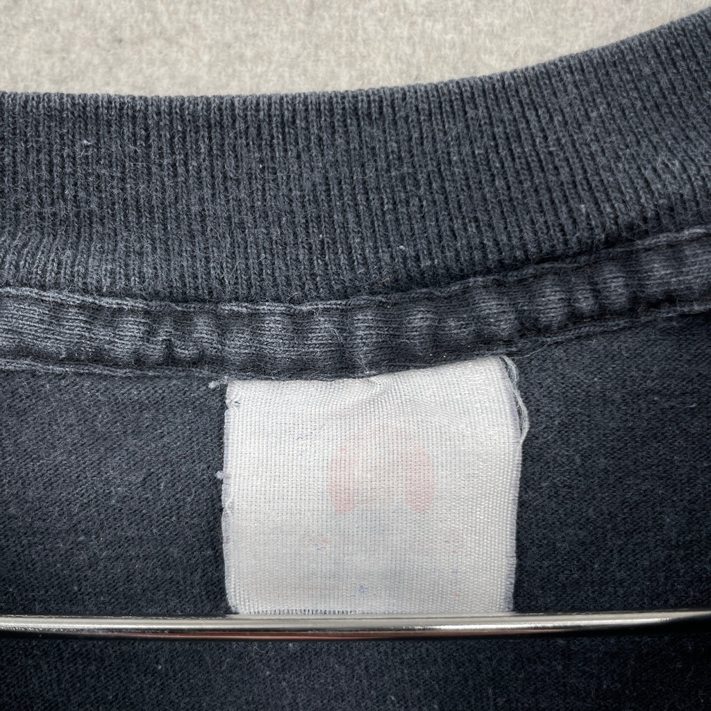 Close-up of a faded label tag unable to display size or material information