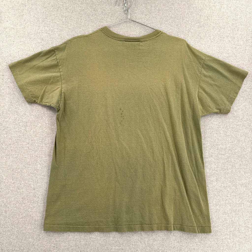 back of green t-shirt on a hanger against a textured white background