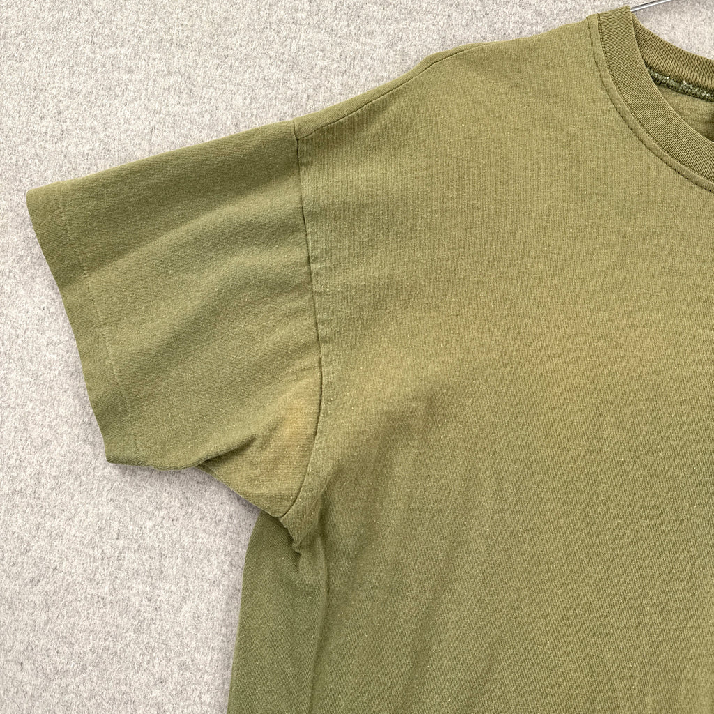 Green shirt slight fading