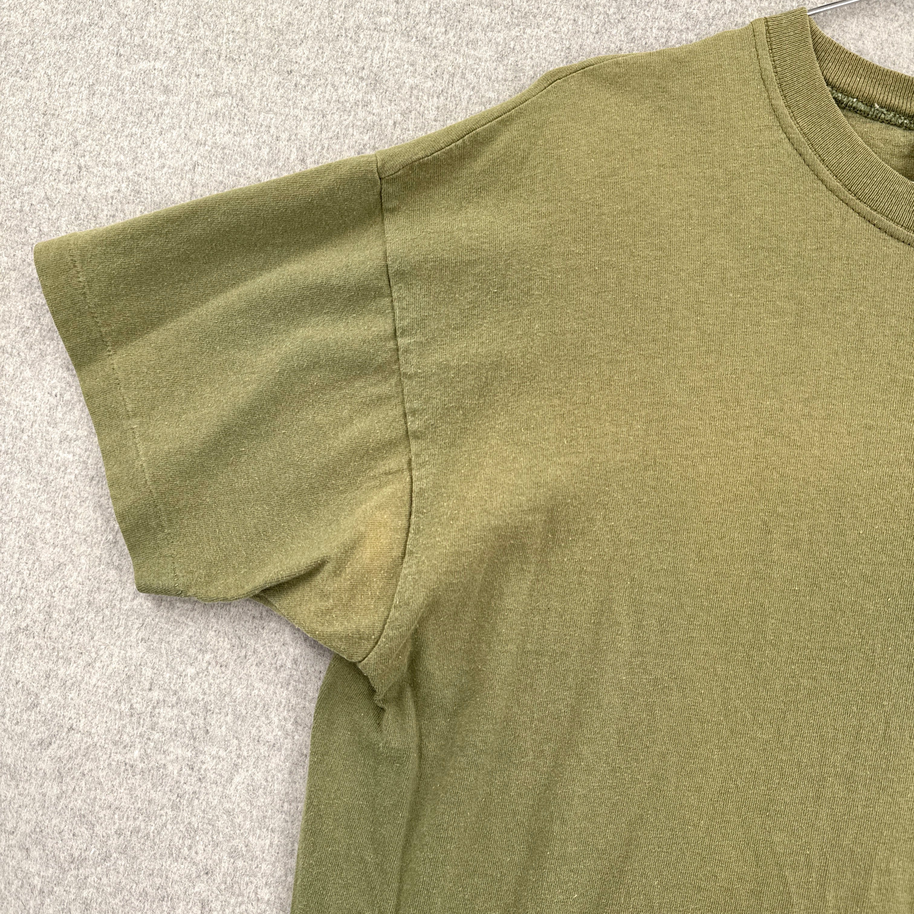 Green shirt slight fading