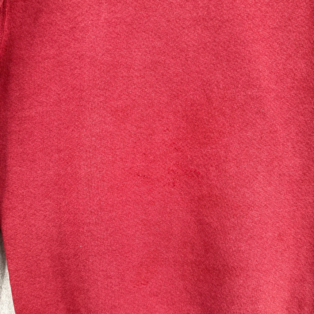 close up of back showing scratch marks in the fabric
