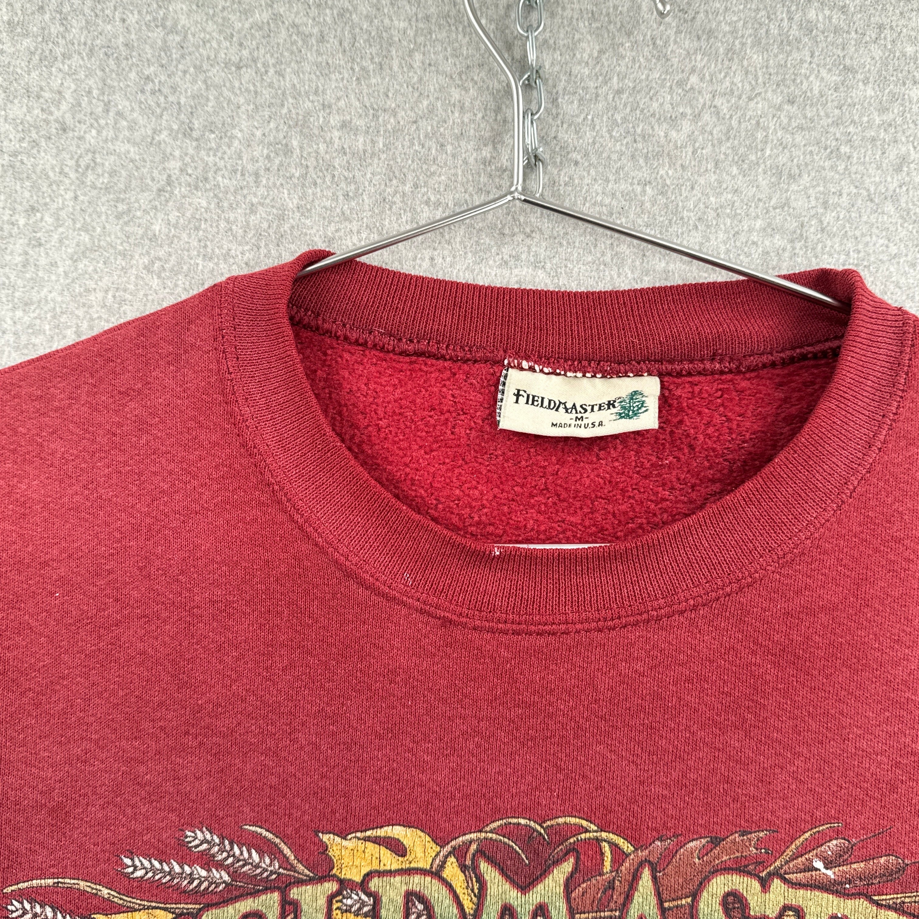 collar of sweatshirt showing tag size Medium