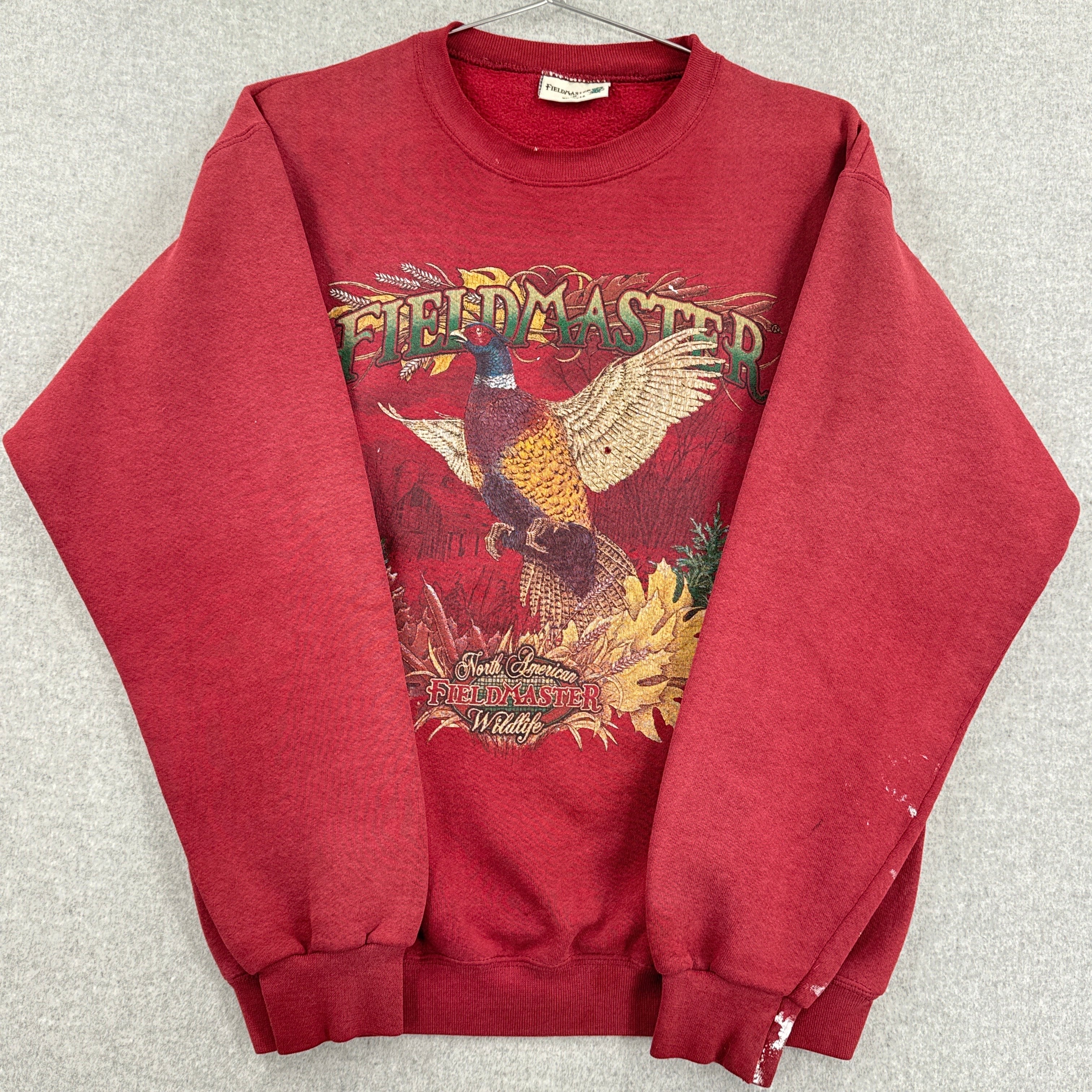 sleeves folded over showing stain spots