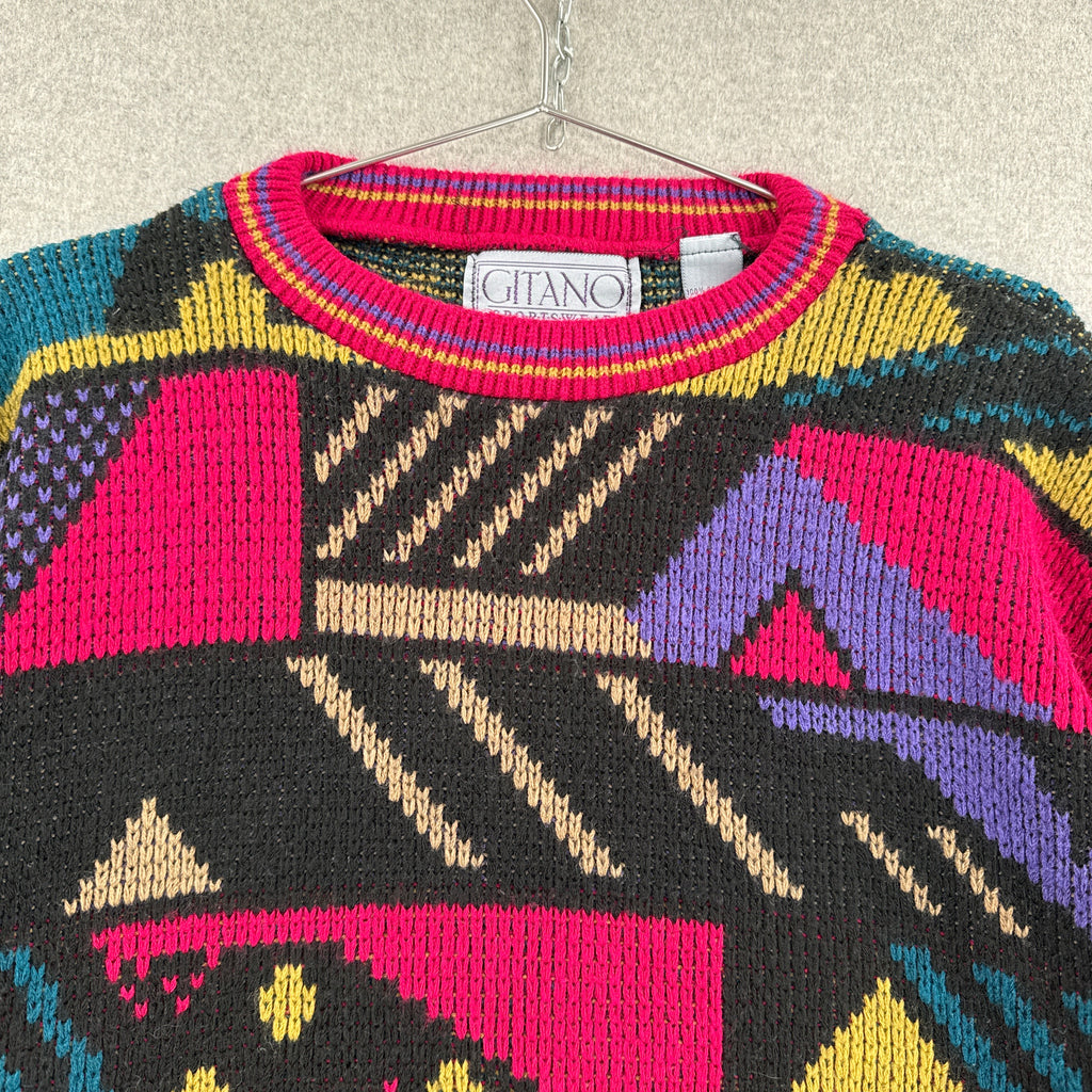 Colorful patterned sweater with brand label on a neutral background