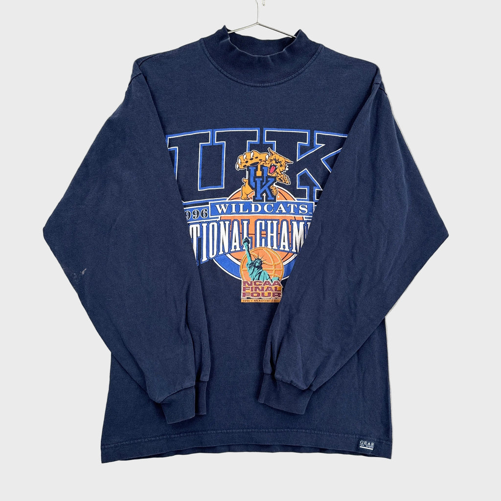 Navy blue long-sleeve shirt with 'Wildcats National Champions' graphic on a light gray background