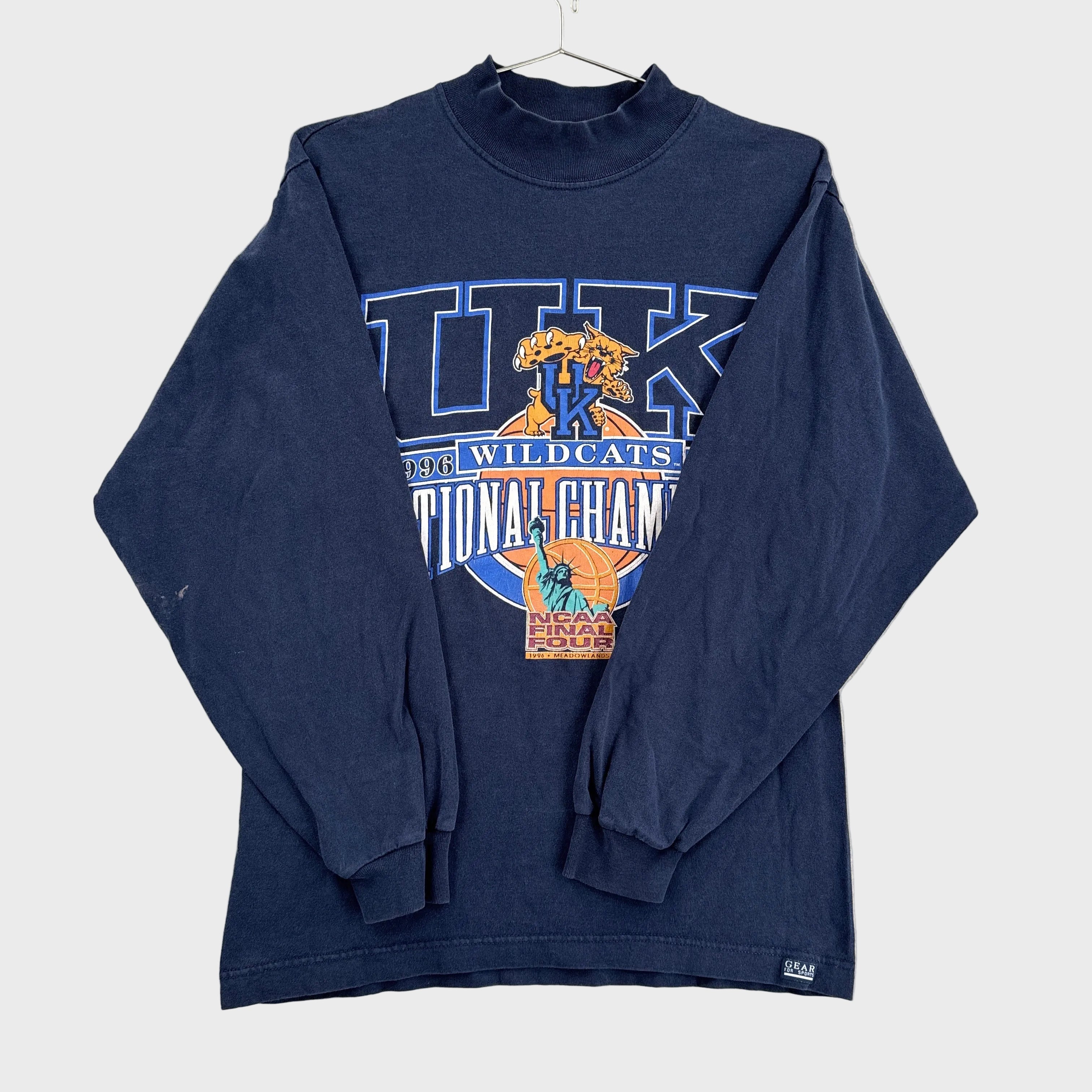 Navy blue long-sleeve shirt with 'Wildcats National Champions' graphic on a light gray background