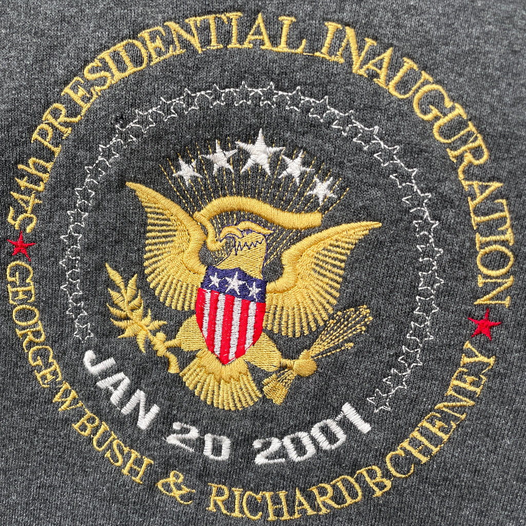 Embroidered patch of the Presidential Inauguration of George W. Bush and Dick Cheney on a dark fabric background.