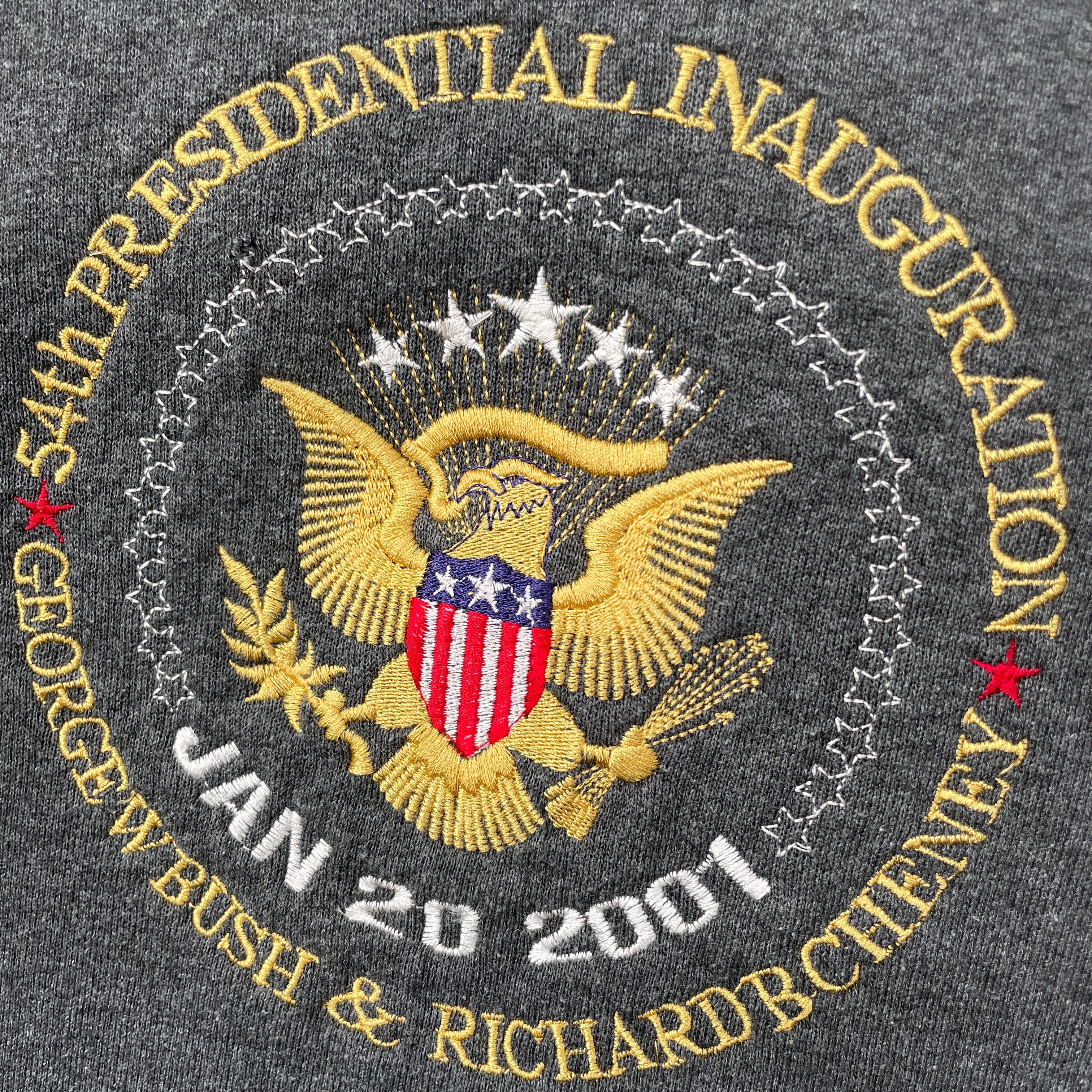 Embroidered patch of the Presidential Inauguration of George W. Bush and Dick Cheney on a dark fabric background.