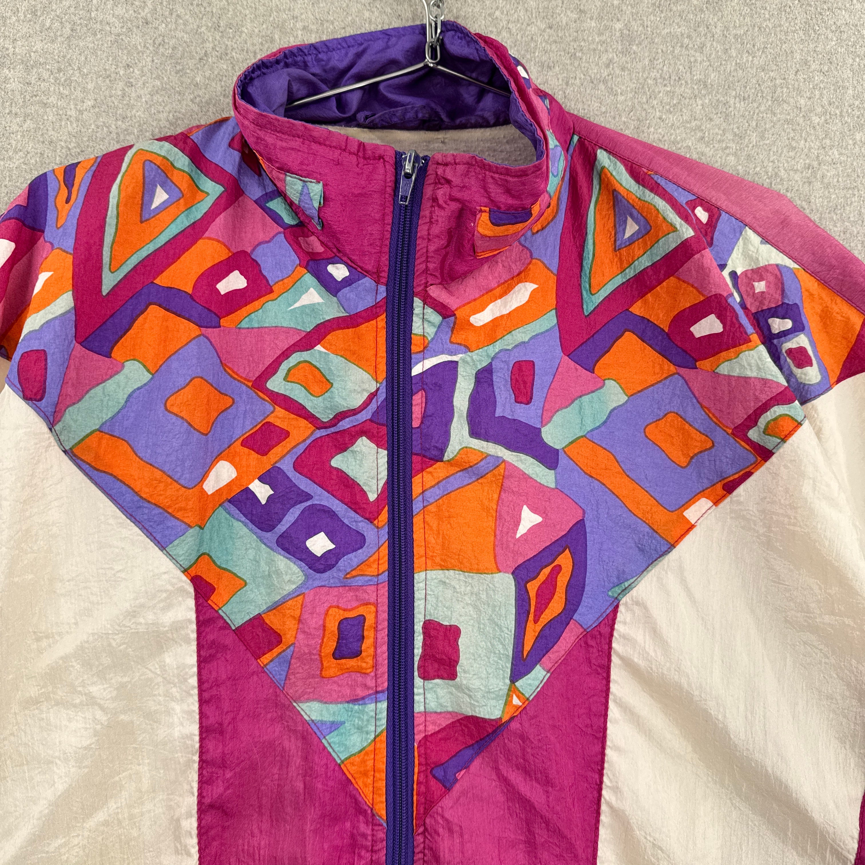 Colorful geometric-patterned jacket on a neutral background