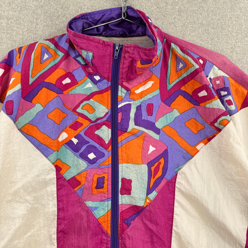 Colorful geometric-patterned jacket on a neutral background