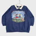 Navy blue sweatshirt with teddy bear design on a beige background