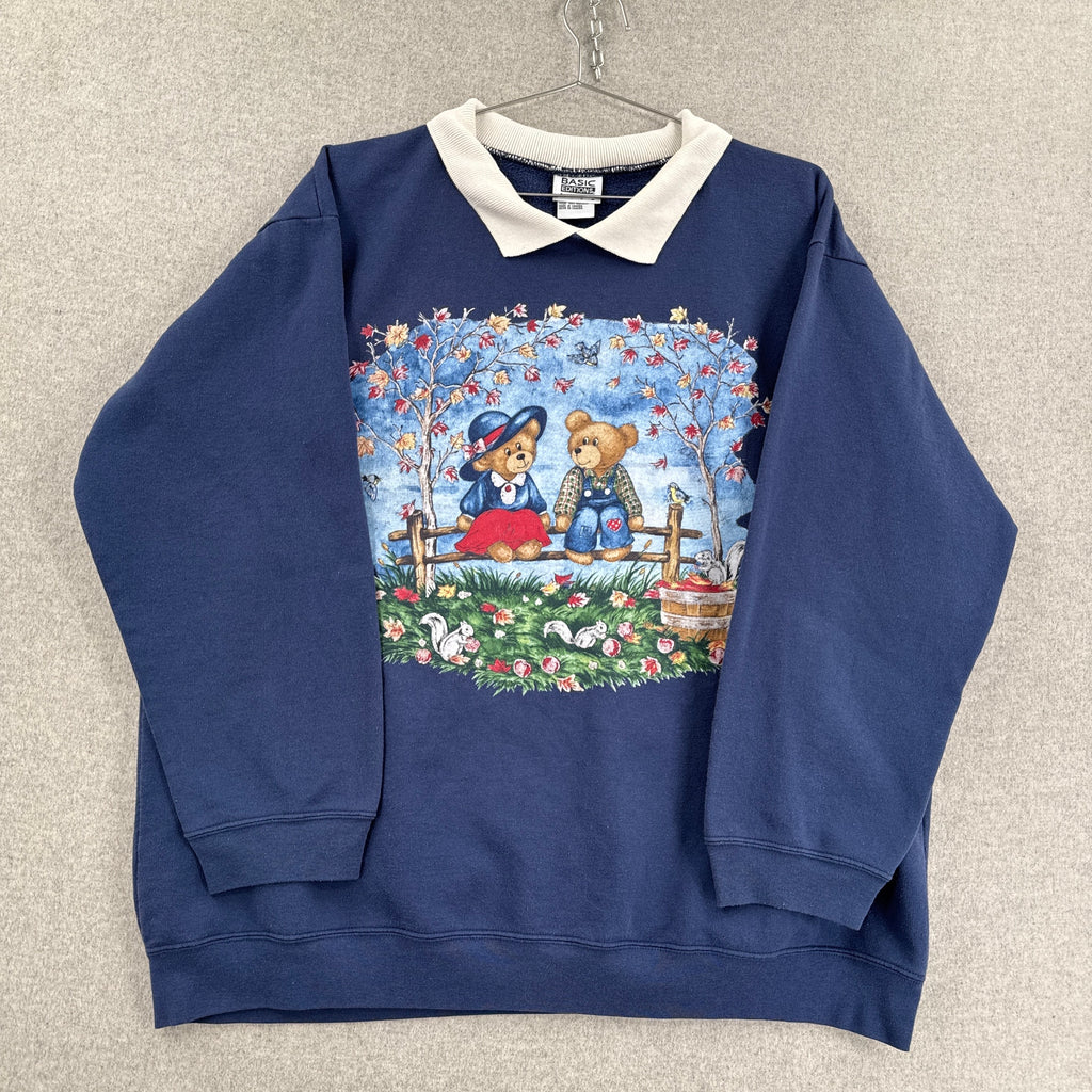 Navy blue sweatshirt with a colorful graphic of two bears sitting behind a fence on a beige background.