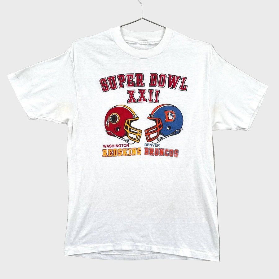White t-shirt with Super Bowl XXII design featuring Washington and Denver Broncos helmets on a gray background.