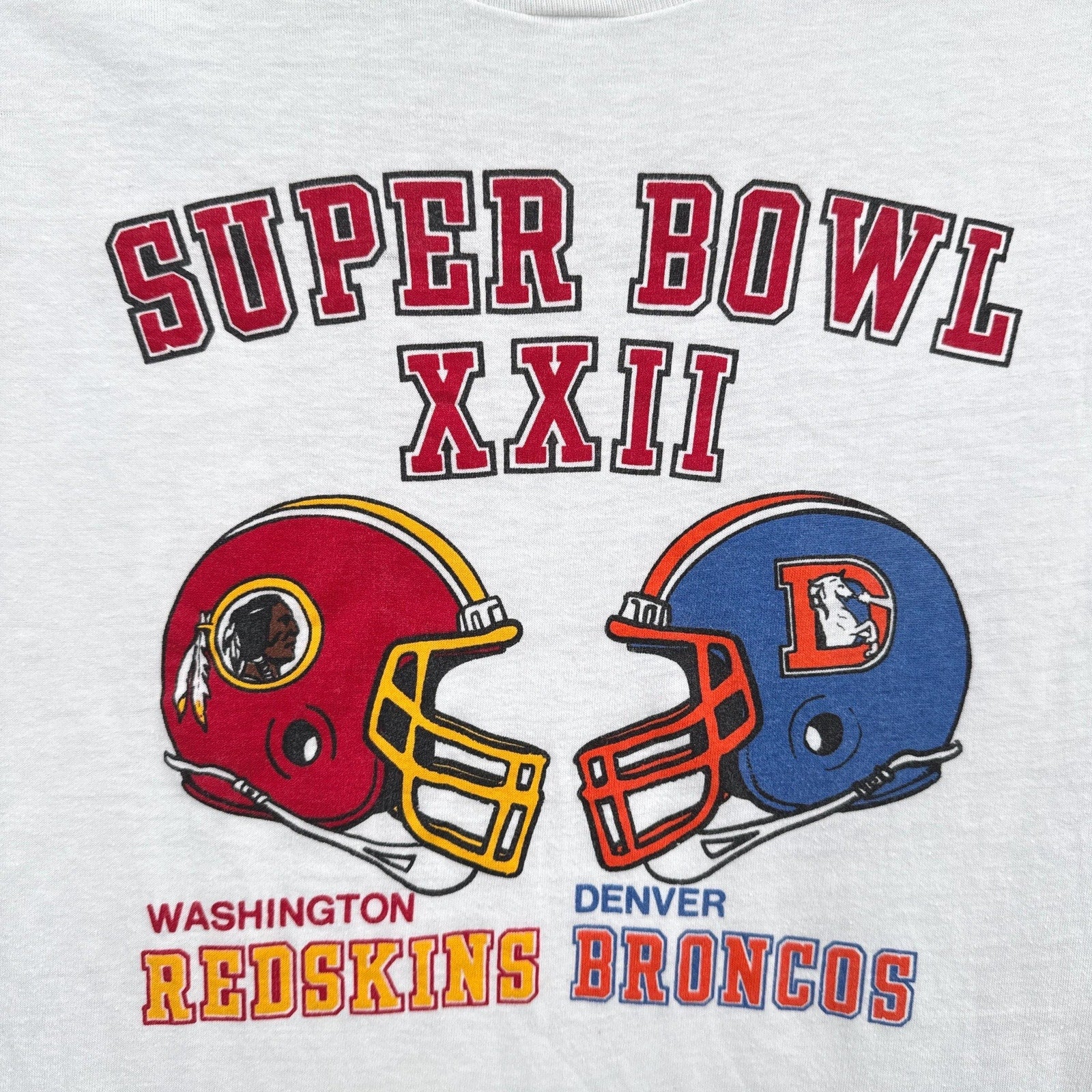 Super Bowl XXII logo featuring Washington and Denver Broncos helmets on a white background