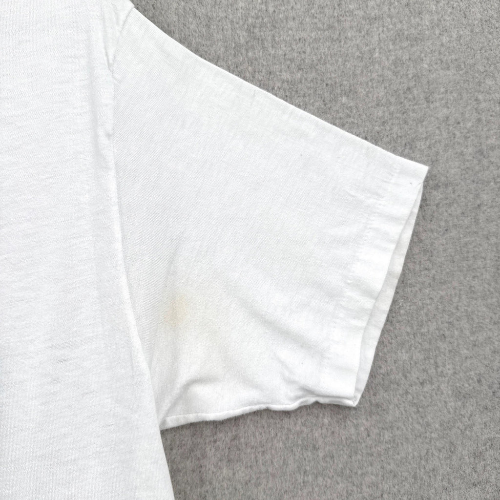 White fabric with a stain on a gray background