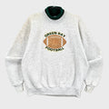 Gray sweatshirt with Green Bay Football logo on a gray background