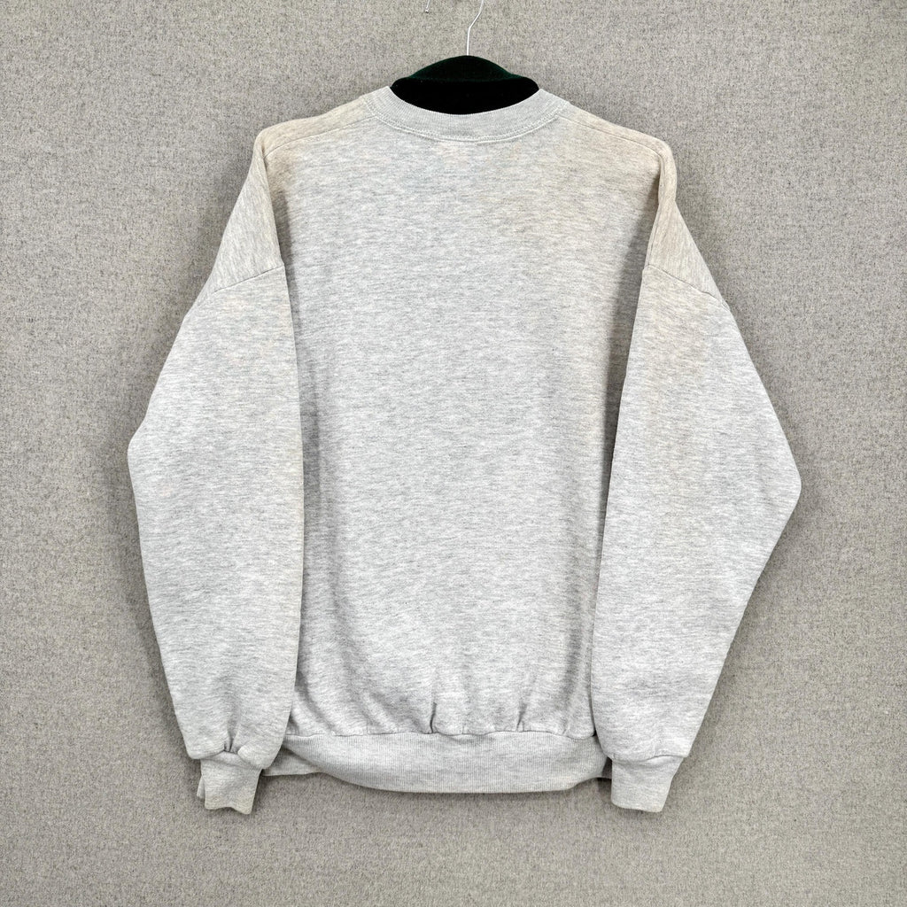 Gray sweatshirt on a hanger against a gray background