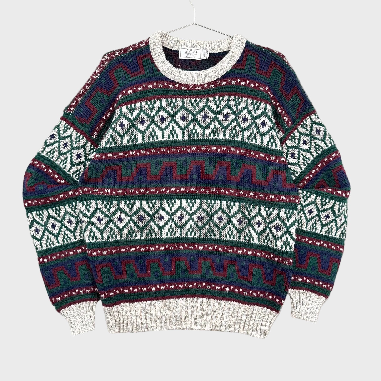 Knitted sweater with a pattern on a gray background
