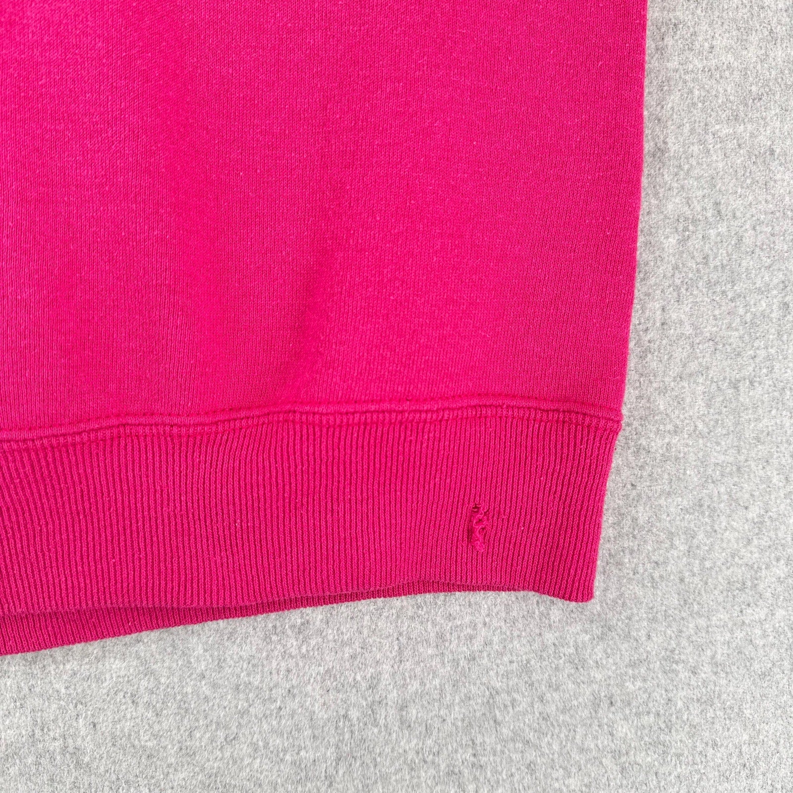 close up of rip on bottom hem