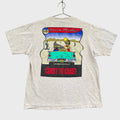 grey t-shirt with a colorful graphic design on a gray background. old school retro car that says "coast to coast" by Ocean Pacific