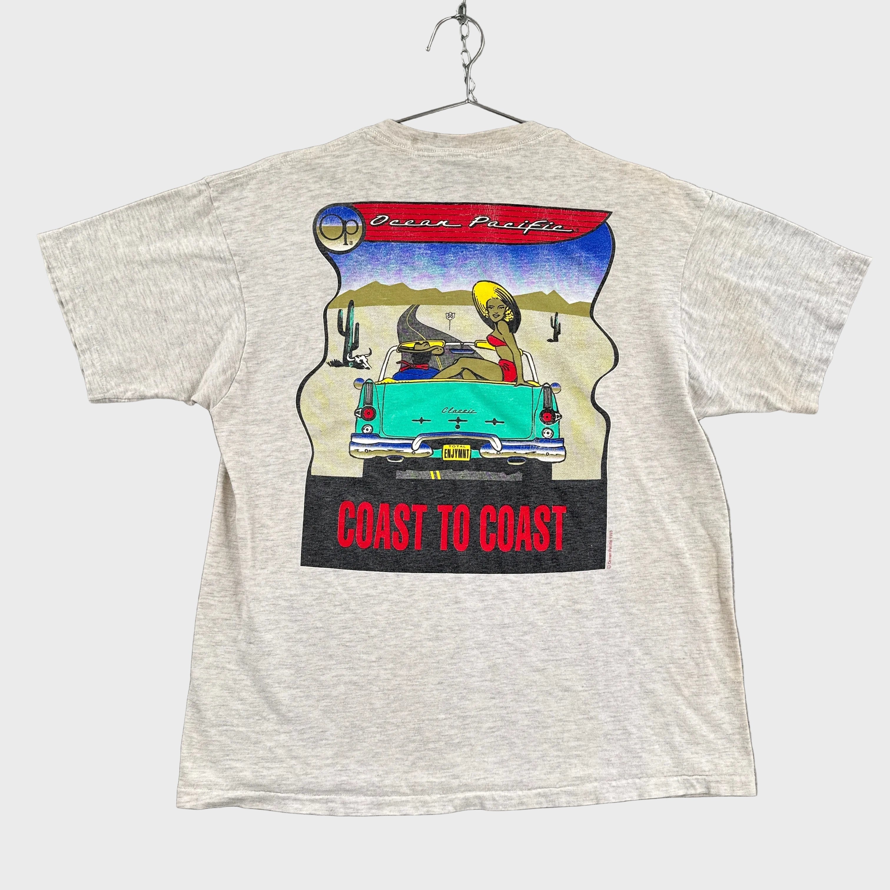 grey t-shirt with a colorful graphic design on a gray background. old school retro car that says "coast to coast" by Ocean Pacific