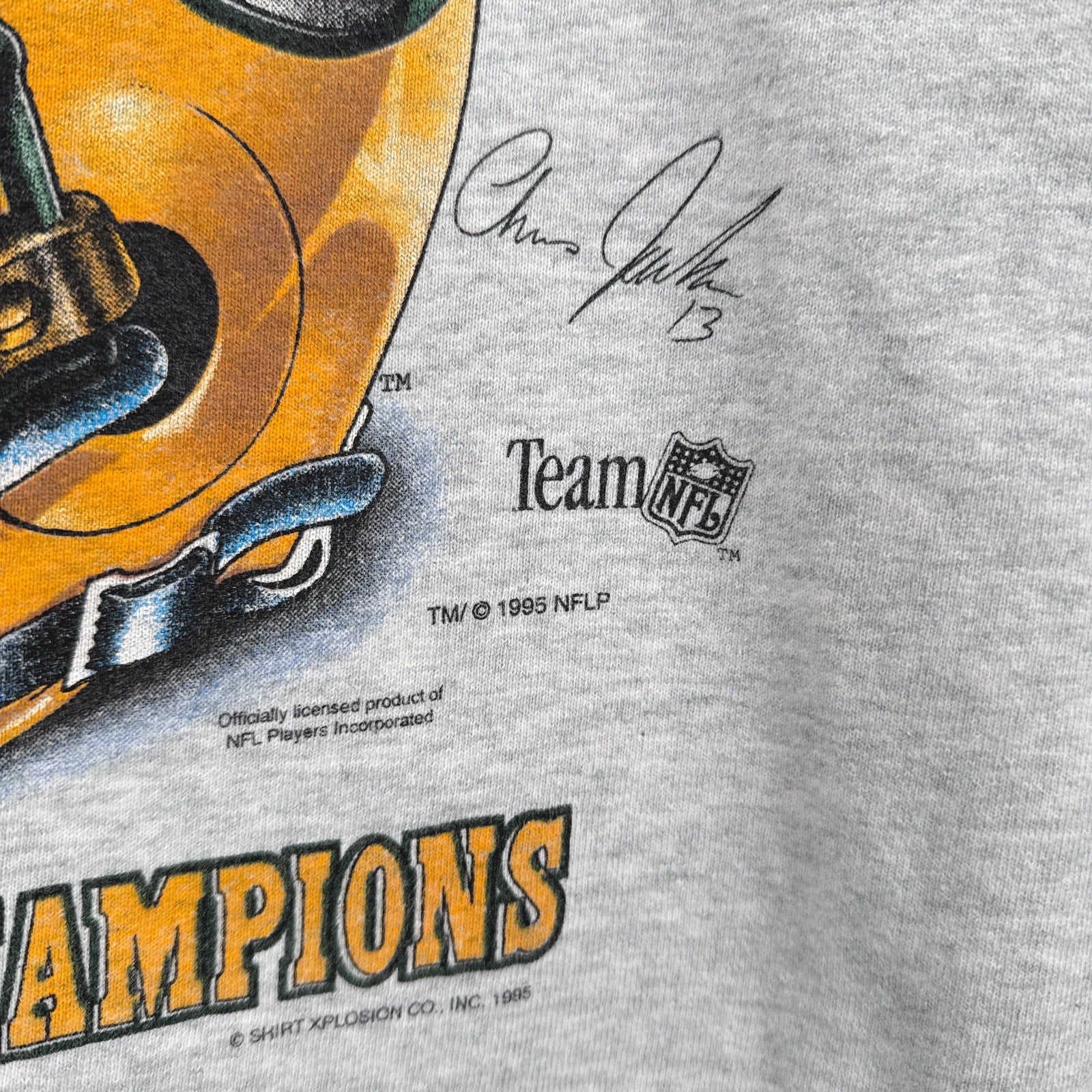 Gray t-shirt with football helmet graphic and 'Chiefs' text, featuring NFL branding.