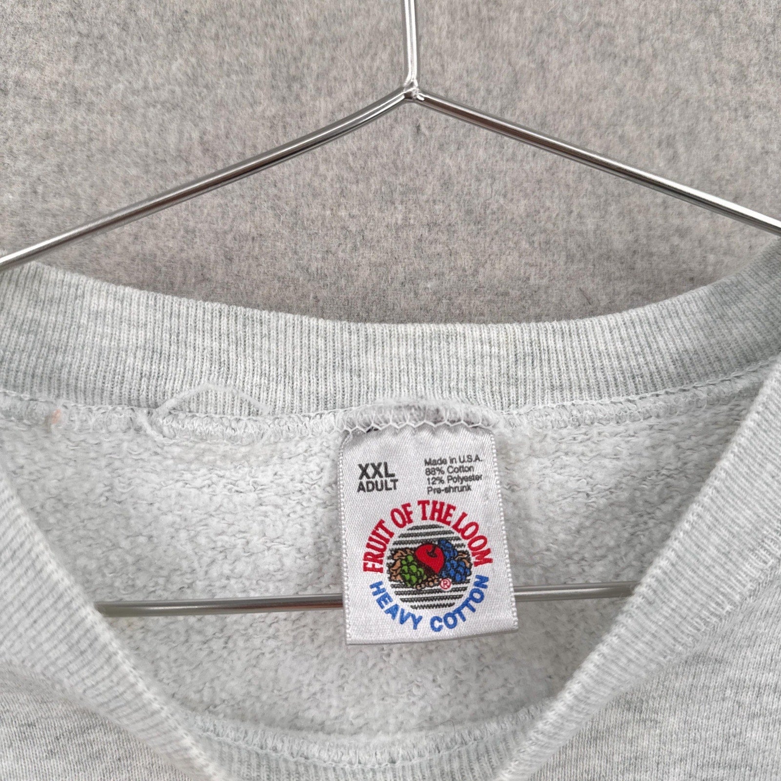 Gray sweatshirt with a 'Fruit of the Loom' label on a hanger. size 2XL 