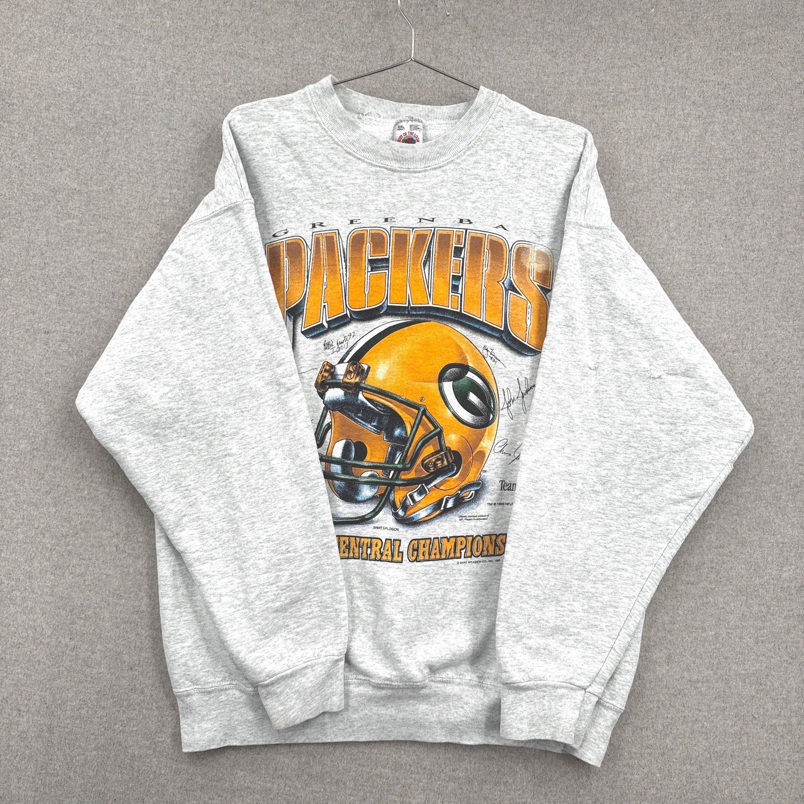 Gray sweatshirt with Green Bay Packers graphic on a gray background