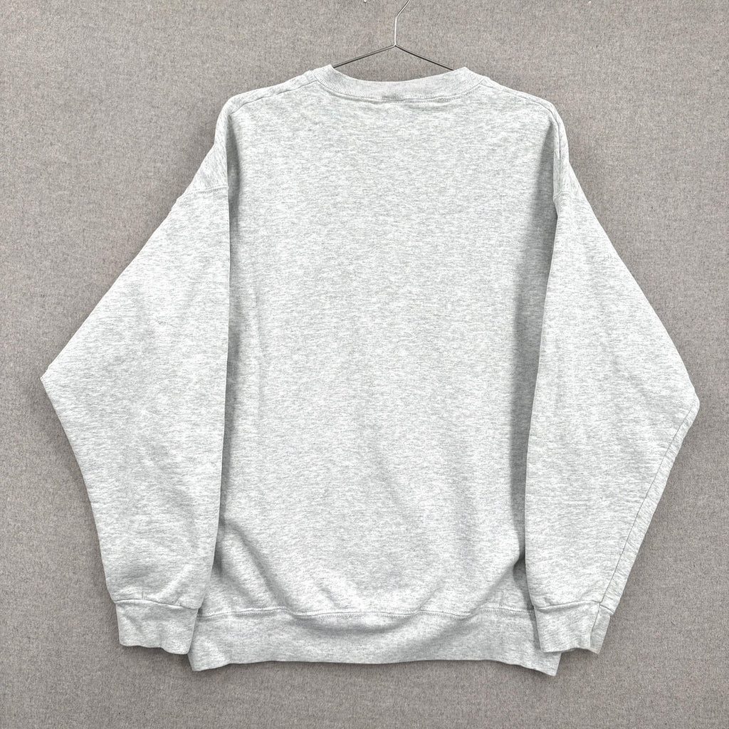 Gray sweatshirt on a hanger against a gray background
