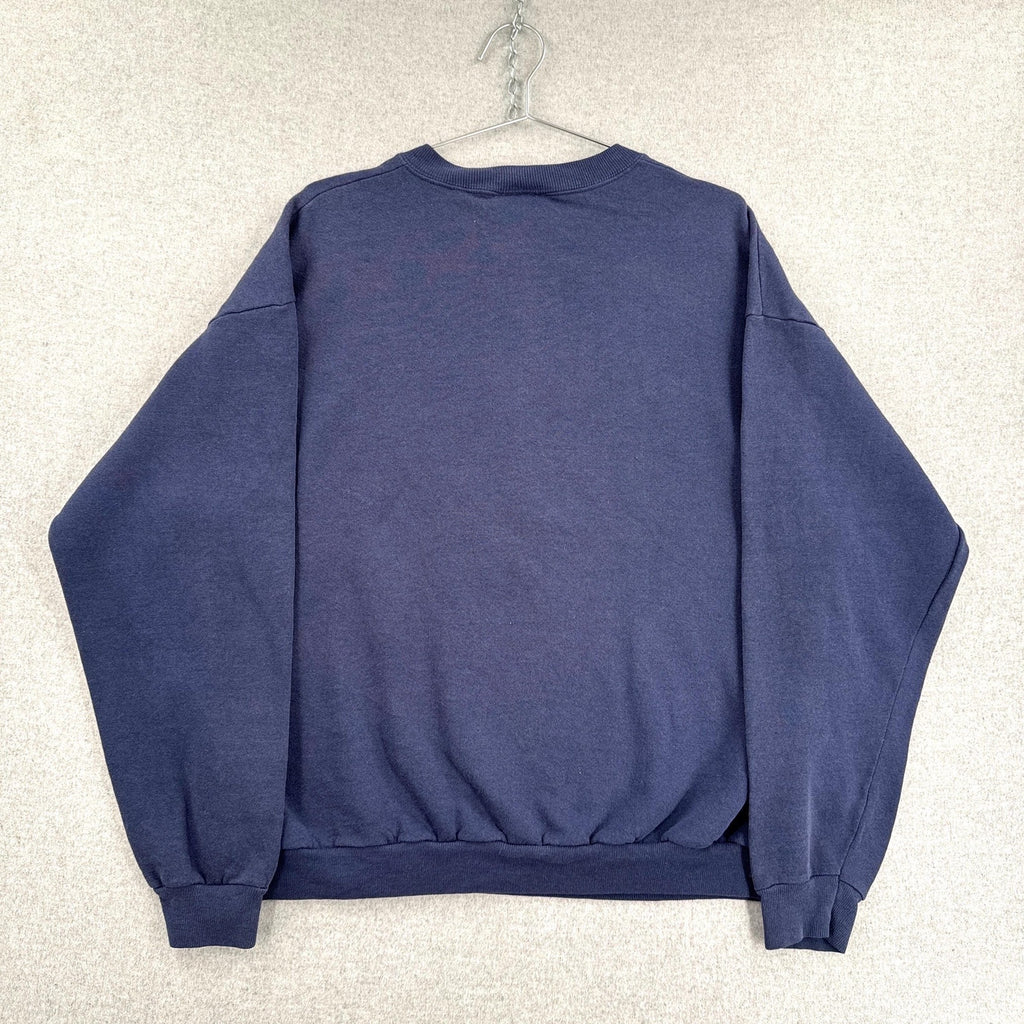 Blue sweatshirt on a hanger against a light gray background