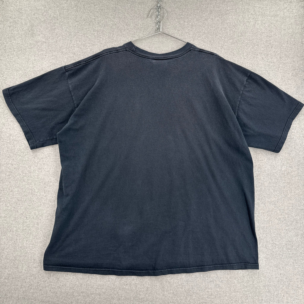 back of shirt on a light gray textured surface