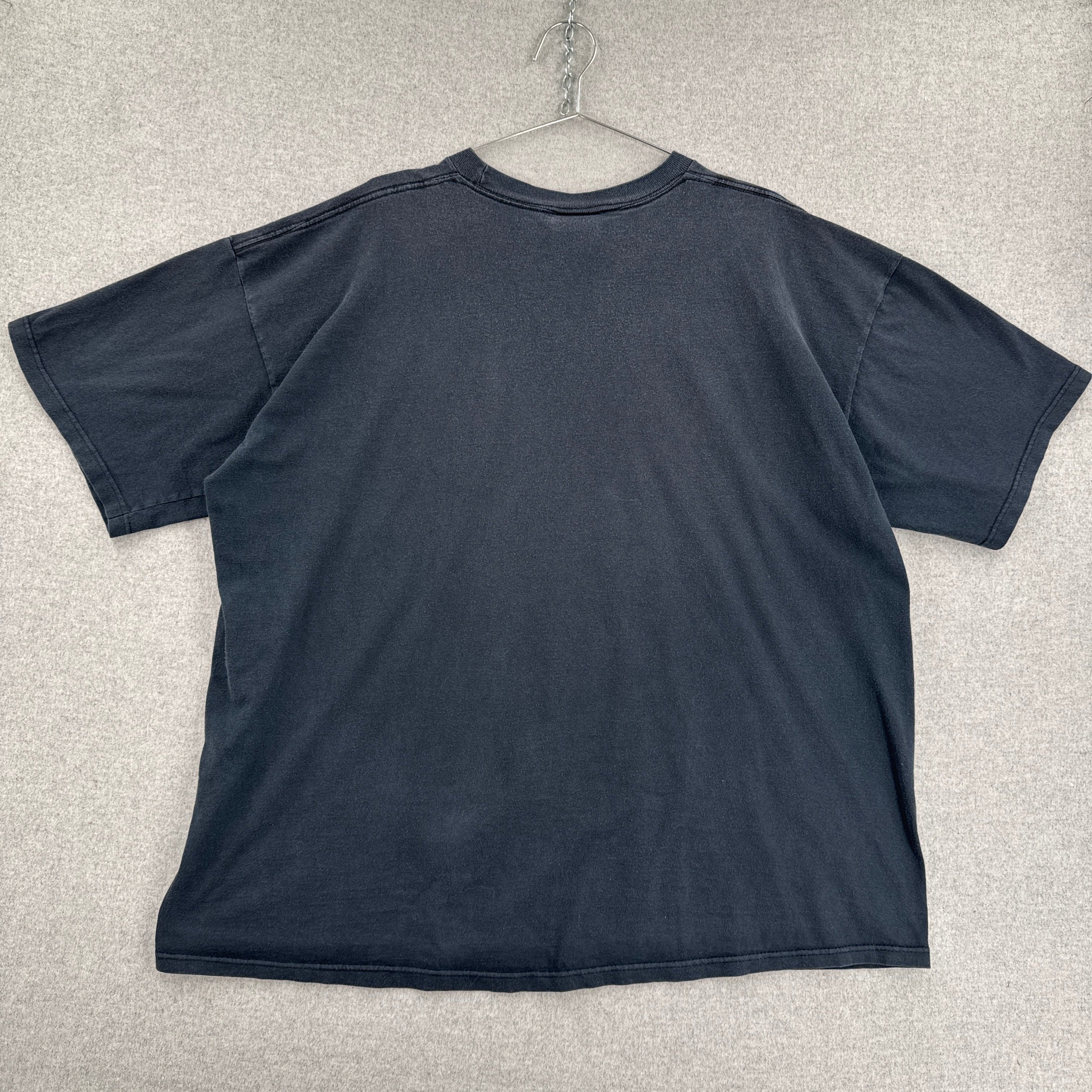 back of shirt on a light gray textured surface