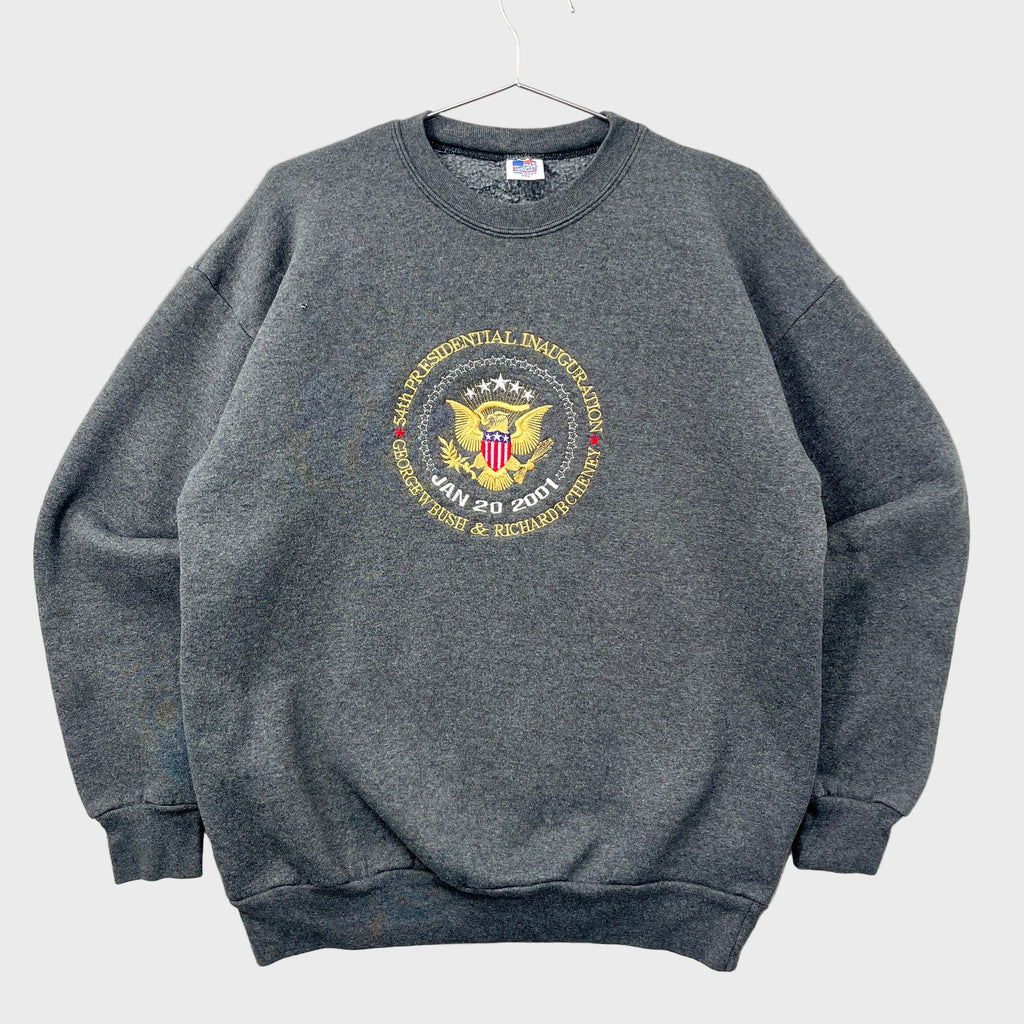 Gray 2001 sweatshirt with a presidential inauguration emblem on a gray background. 54th inauguration on January 20th 2001 for George W Bush and Richard B Cheney.