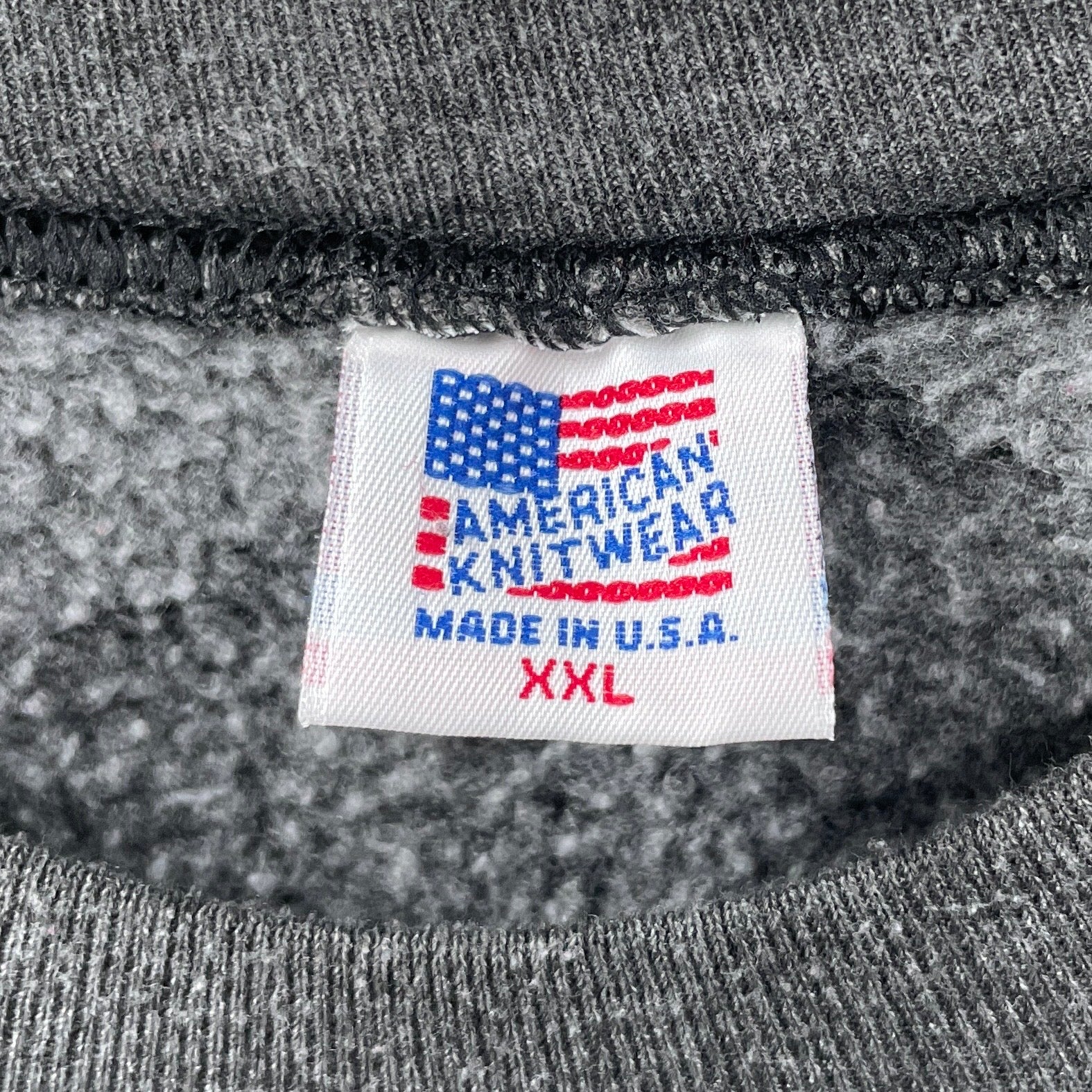 Gray knitwear with an 'American Knitwear Made in U.S.A. XXL' label.