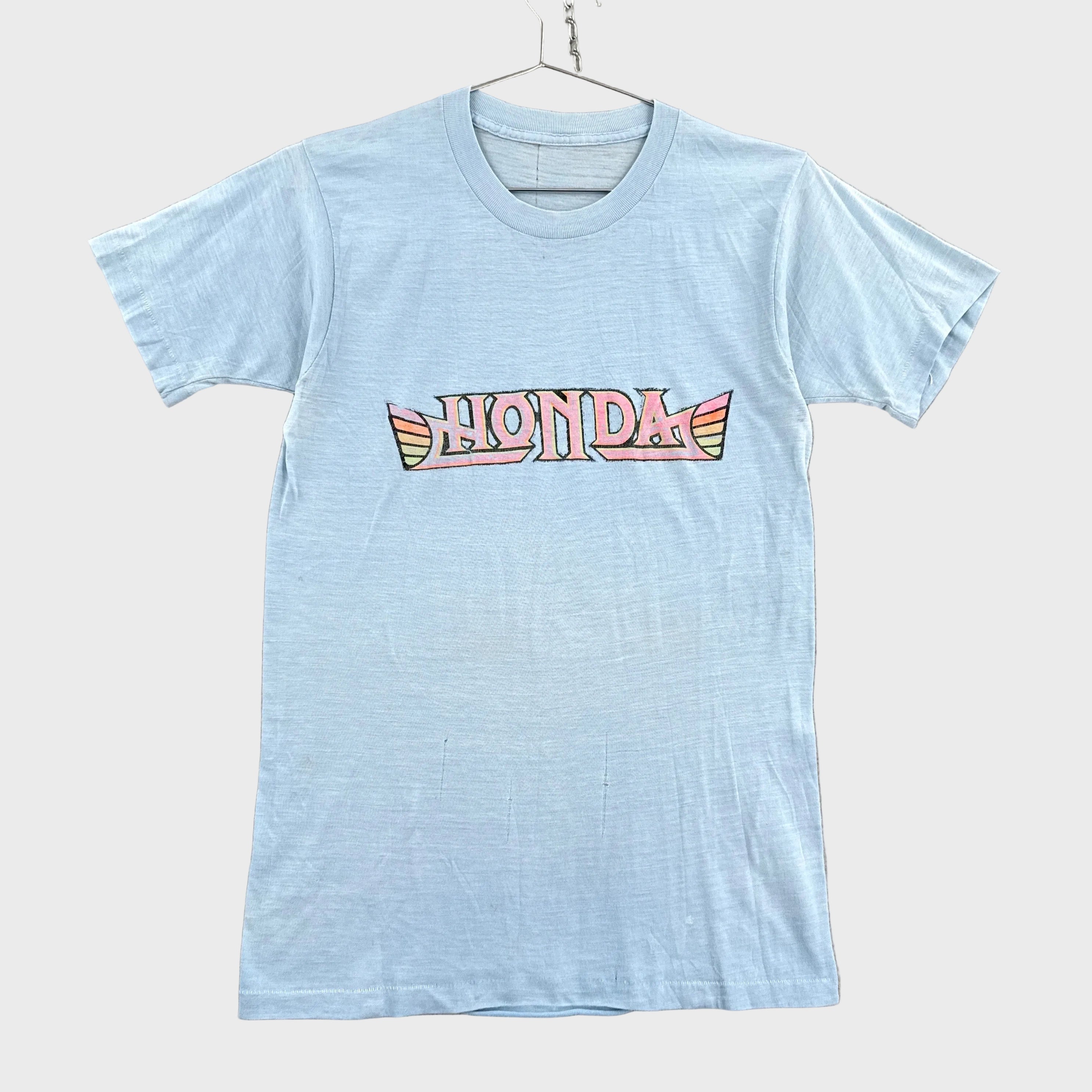 Light blue t-shirt with Honda logo on a gray background