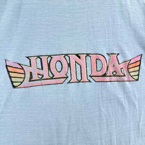 Vintage-style Honda logo on a light blue background