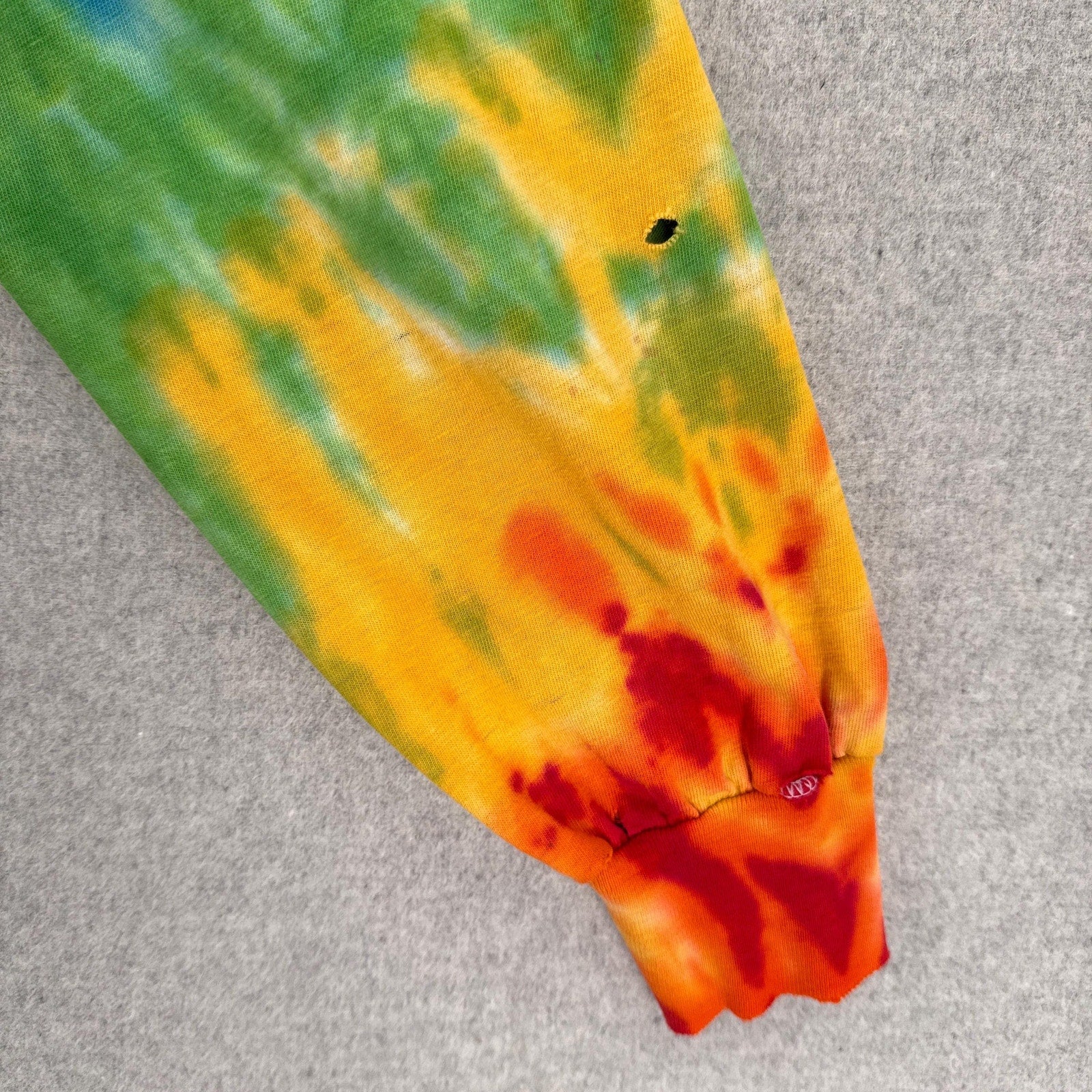 Colorful tie-dye pattern on a textured surface
