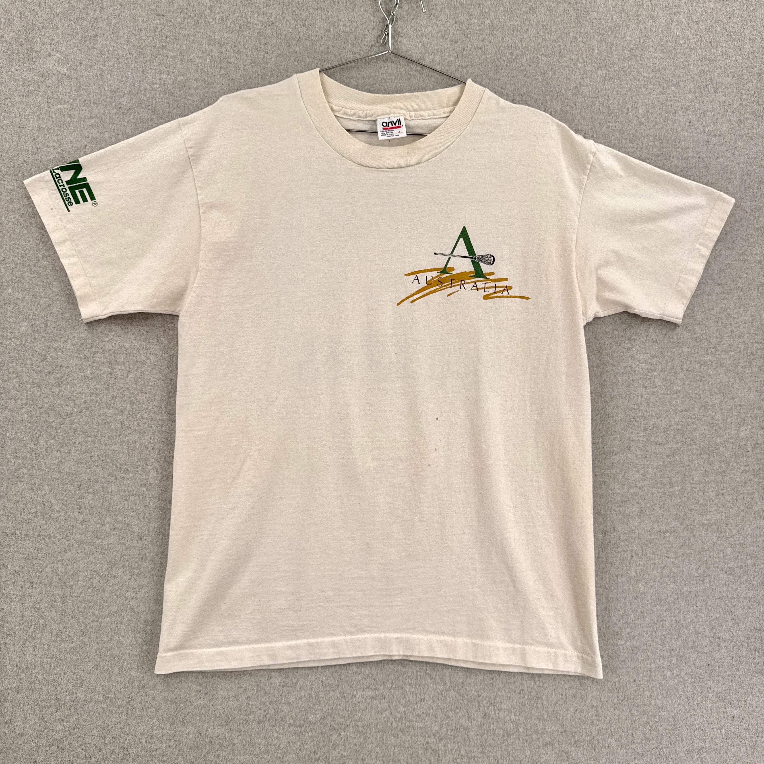 Beige t-shirt with a logo on a gray background