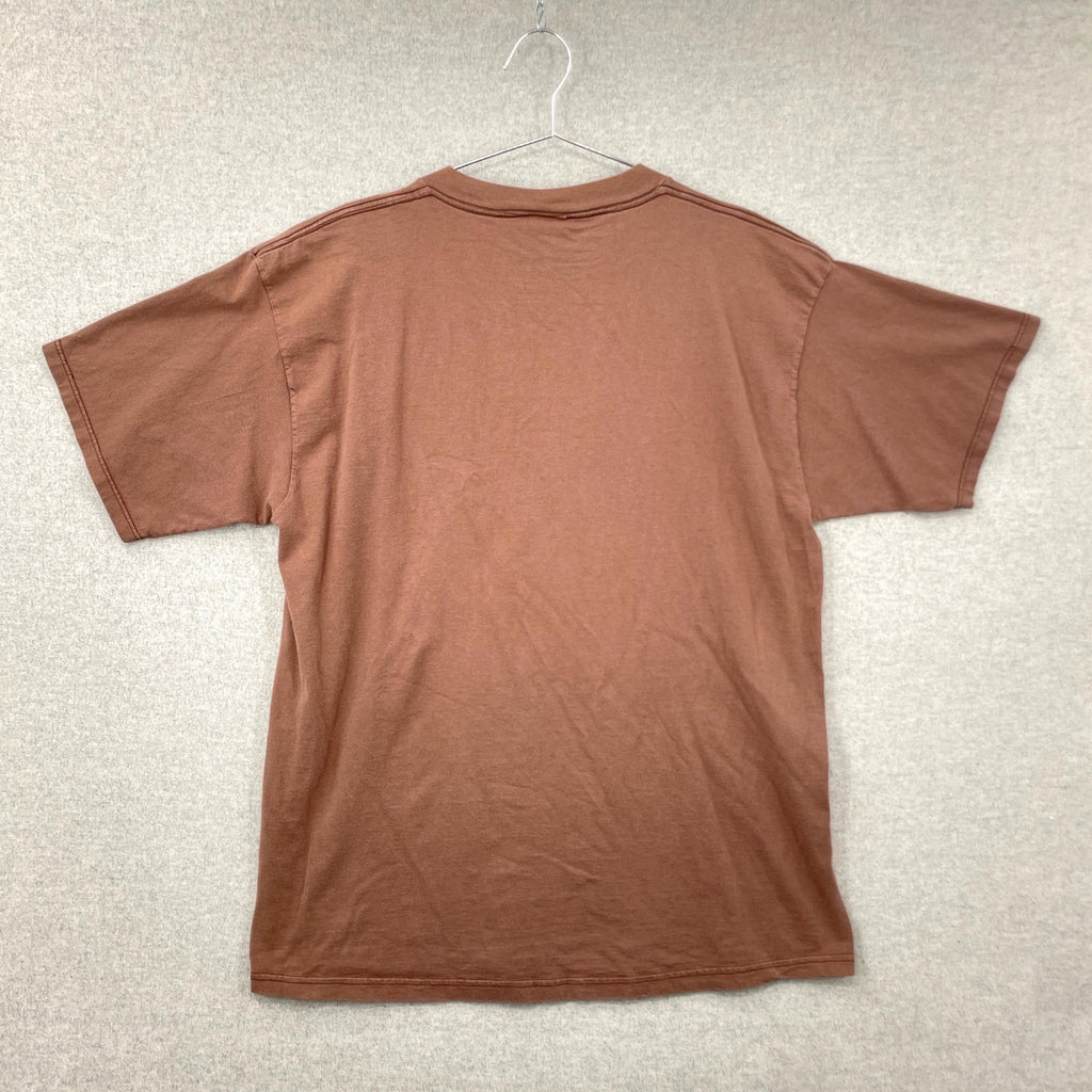 Brown t-shirt on a hanger against a neutral background