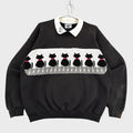 Black sweater with cat pattern on a gray background