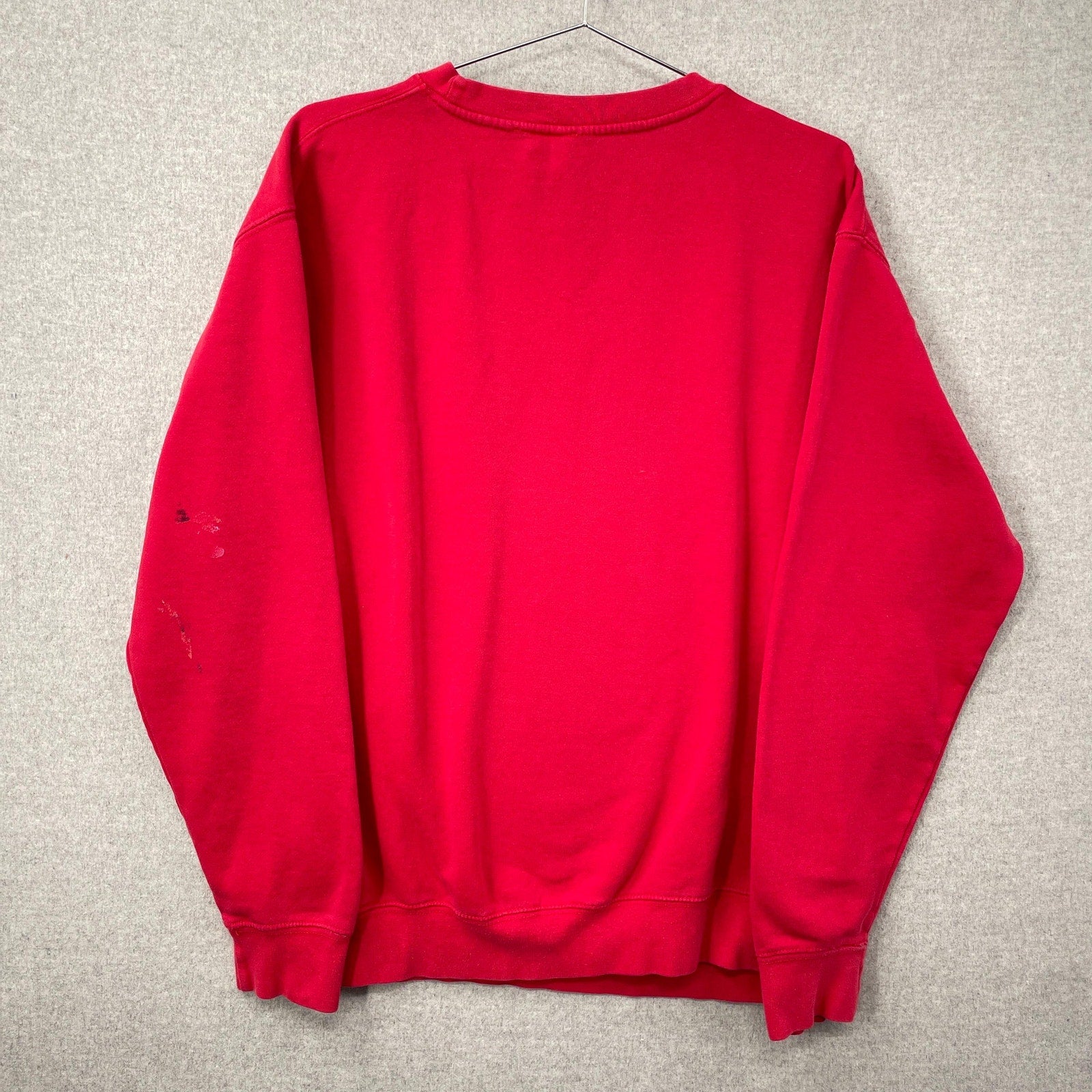 Red sweatshirt on a gray background
