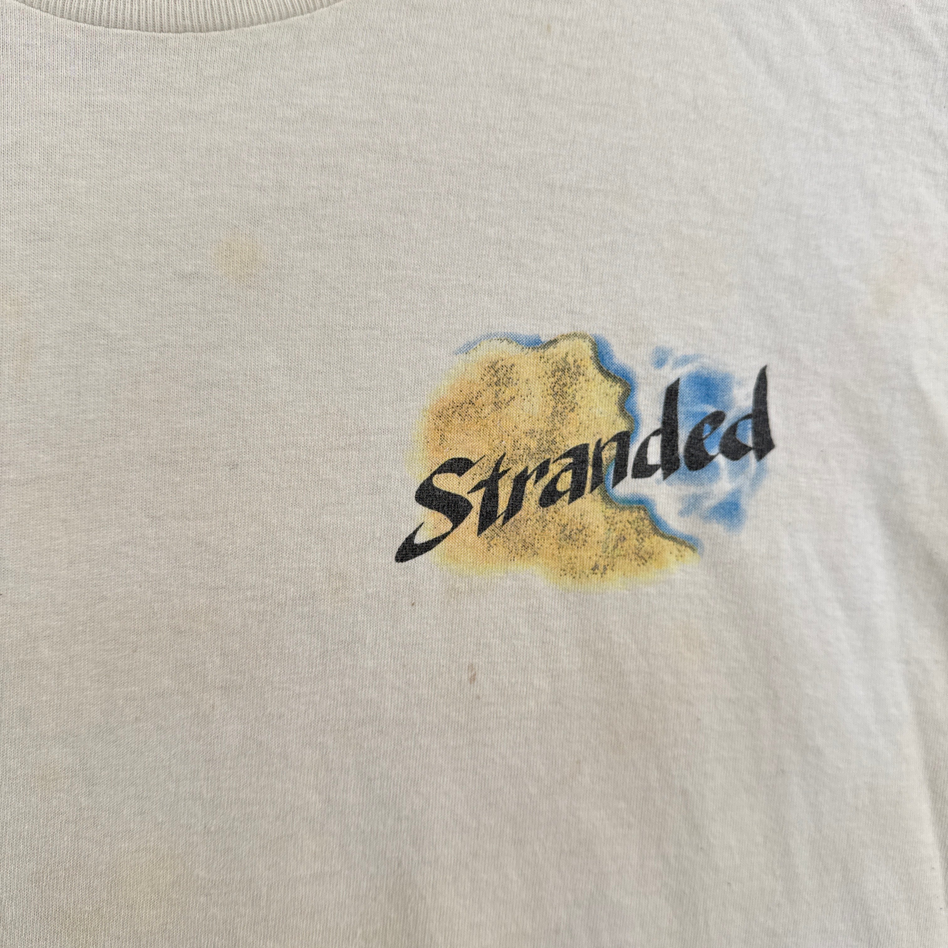Logo with 'Stranded' text on a textured beige background