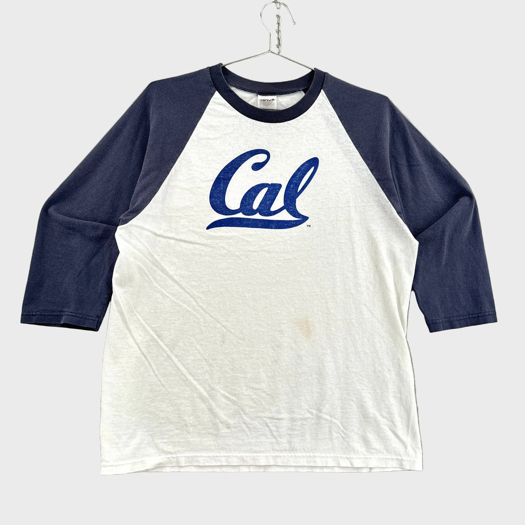 White and navy baseball shirt with 'Cal' logo on a gray background
