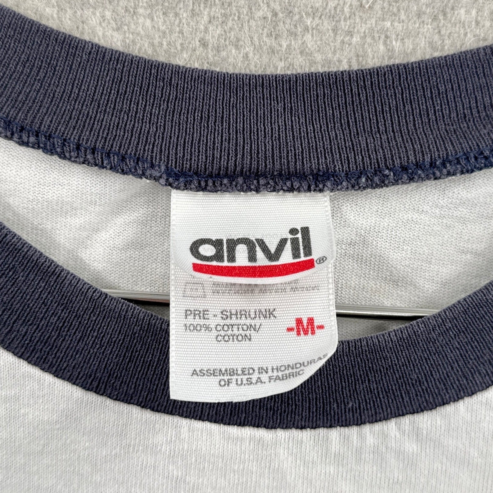 Anvil label on a shirt with navy and gray fabric. size Medium 100% cotton