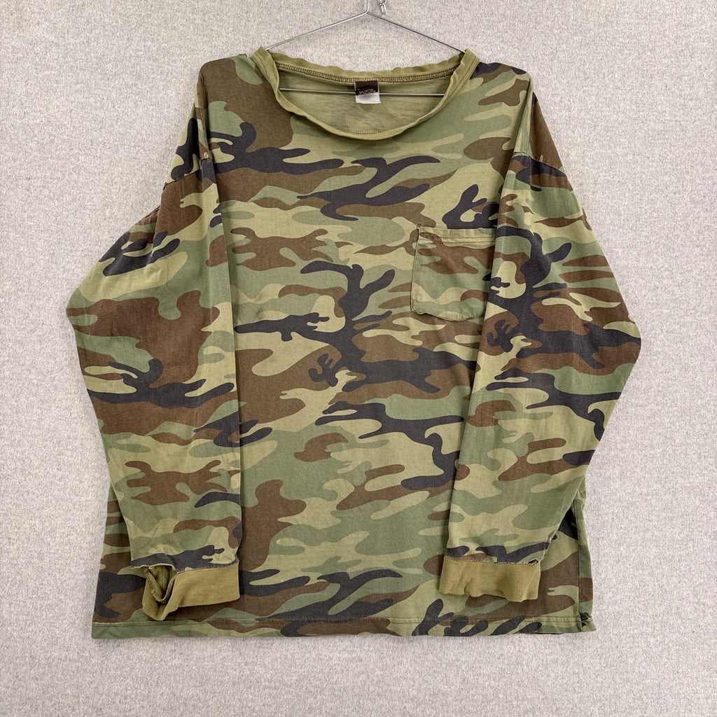 Folded camouflage t-shirt on a light gray background