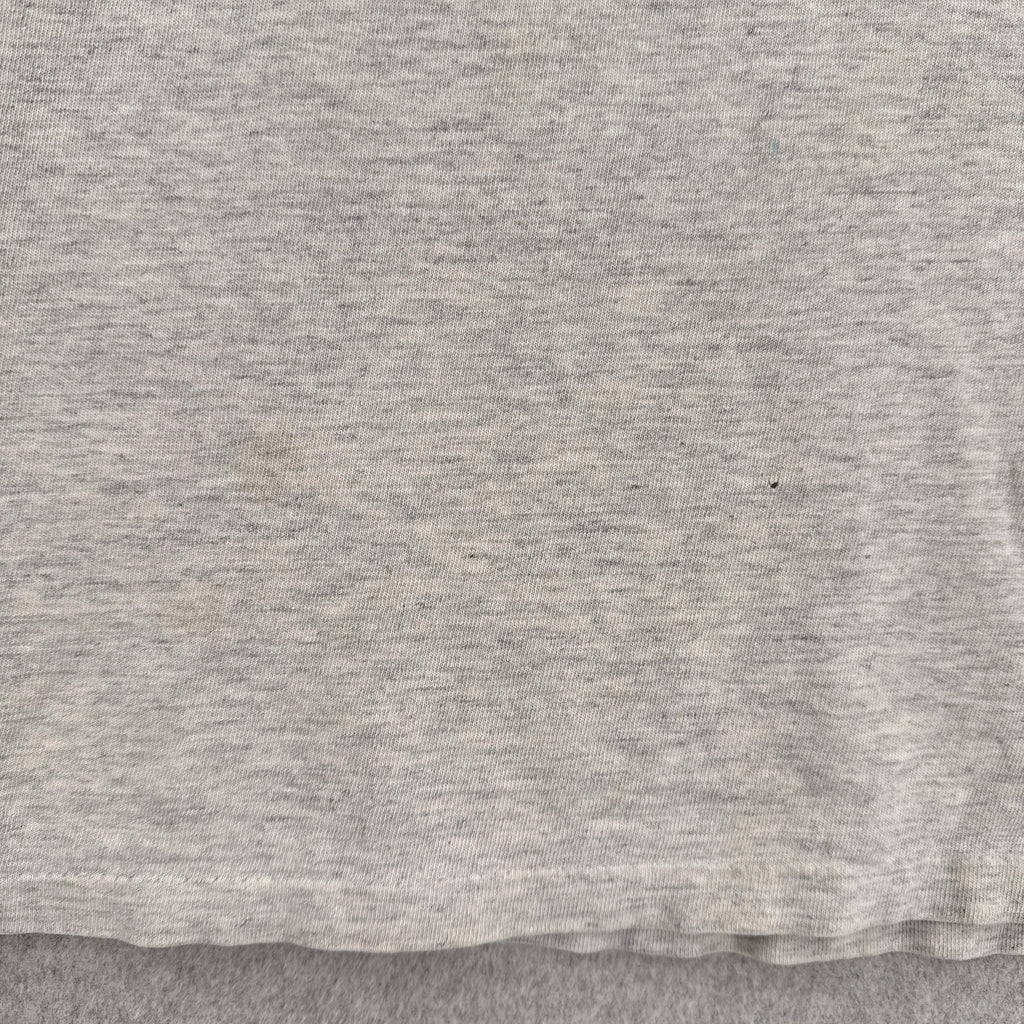 close up of stain spots and small hole