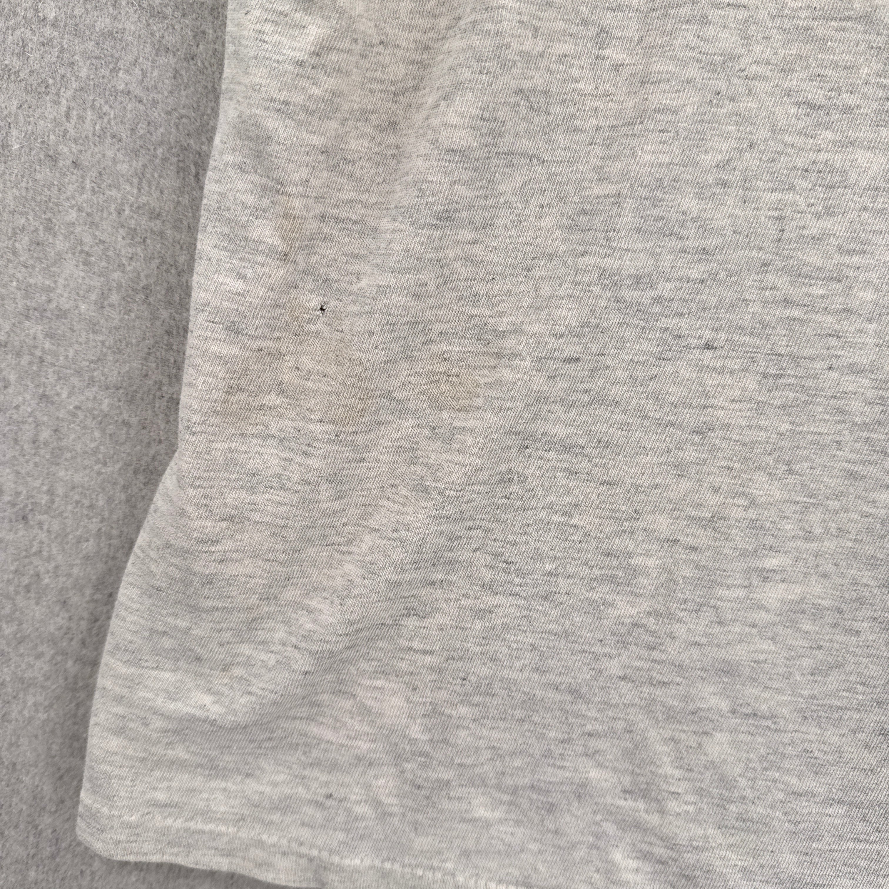 close up of stain spot and small hole
