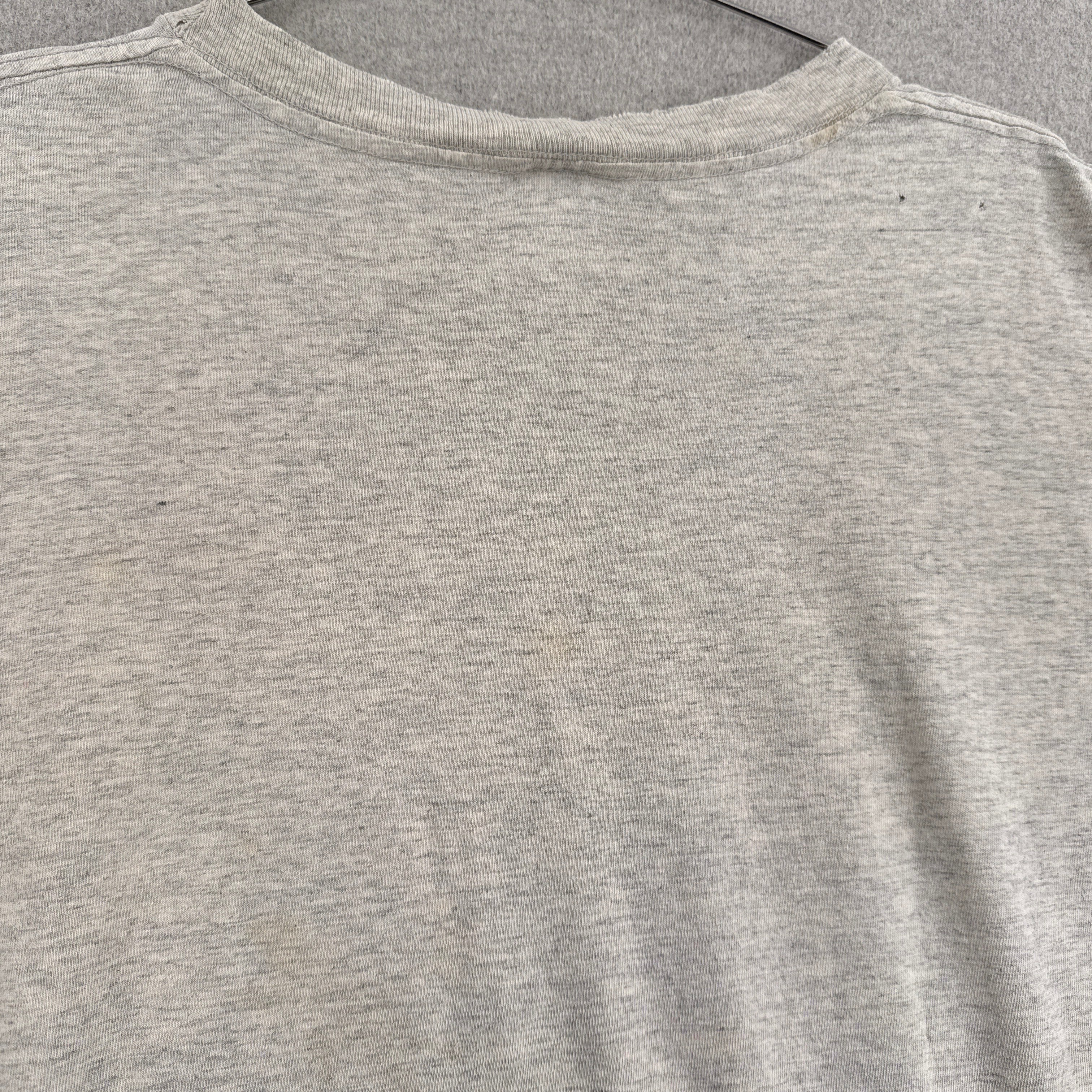 back of shirt with discolouration and hole